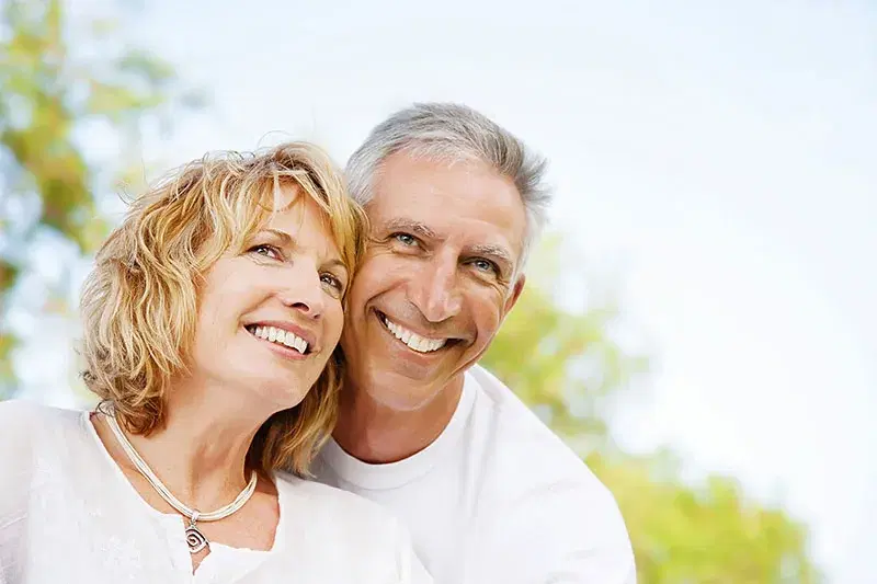 Smiling older couple outdoors